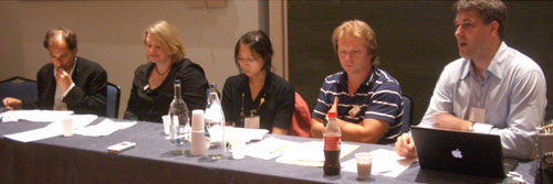 Panelists, with Nico Macdonald speaking 
